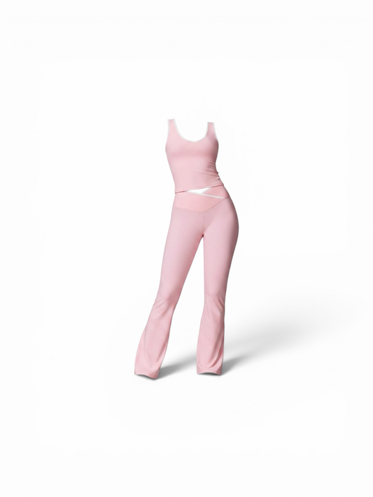 TASTEYBOUTIQUE ribbed knit tank top and flared pants set in pastel pink with white trim. Comfortable loungewear.